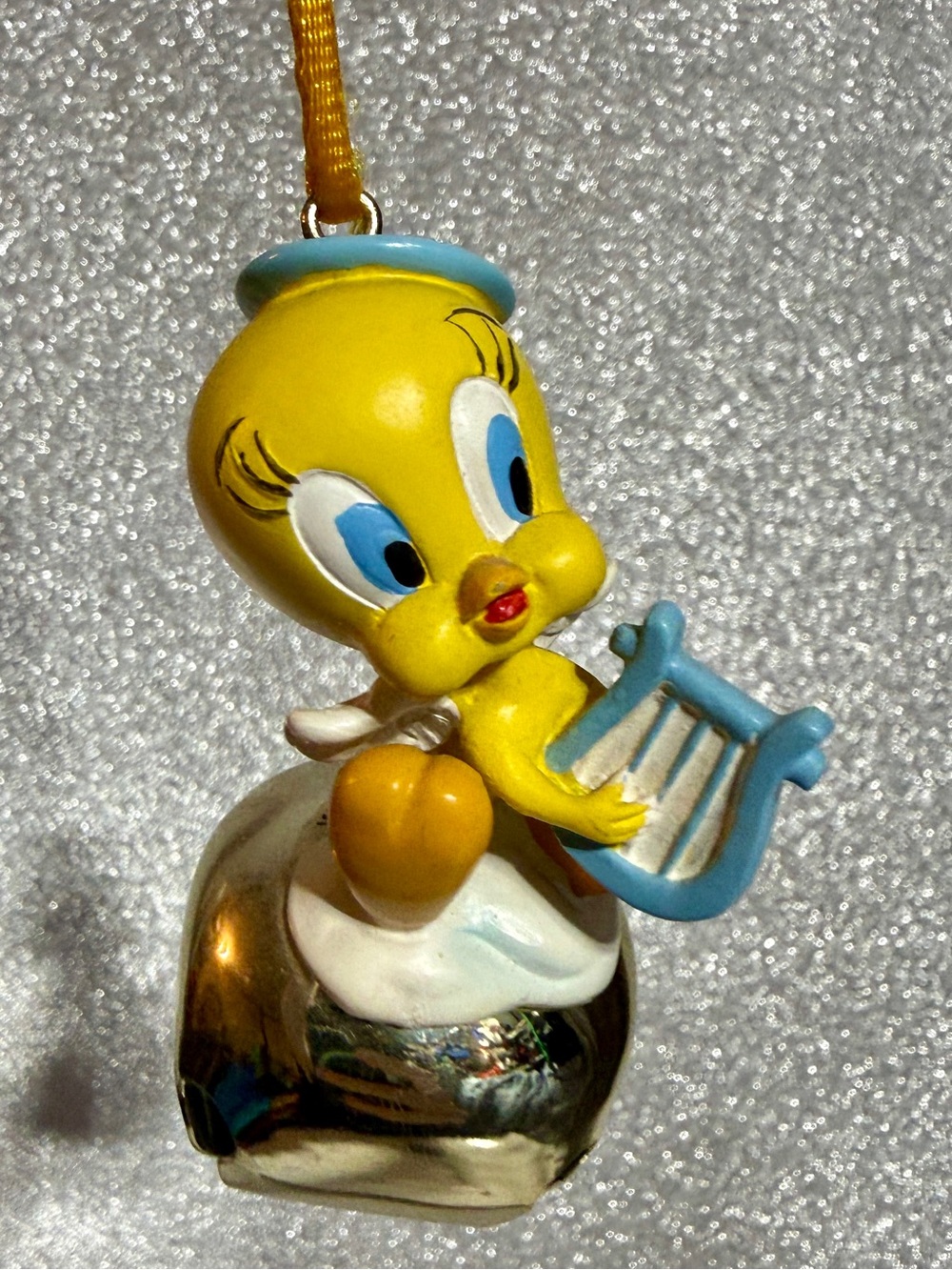 Warner Bros. Tweety Angel w/ harp on gold Jingle Bell Necklace w/ yellow cord.